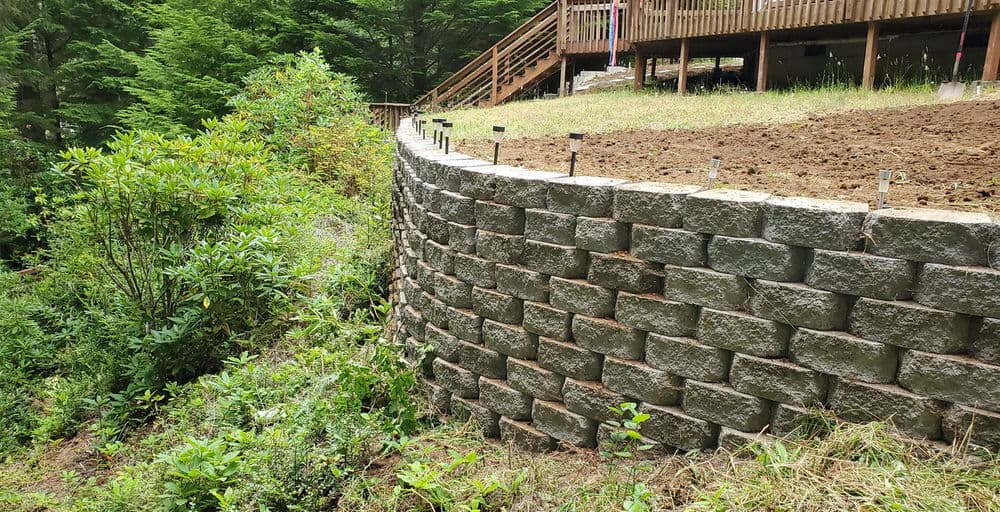 Lake House Landscaping With Retaining Walls, Drainage, and Sprinklers image
